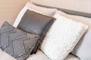 a pile of pillows sitting on top of a bed at 1 Private Double Bed In Sydney CBD Near Train UTS DarlingHar&ICC&C hinatown - ROOM ONLY in Sydney