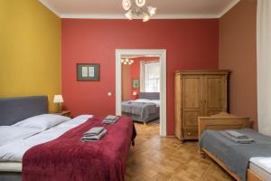 Posteľ alebo postele v izbe v ubytovaní Liliova Apartments