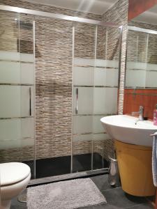 a bathroom with a sink and a toilet at APARTAMENTo MADRID CENTRO GRAN VIA - CALLAO in Madrid +49 photos