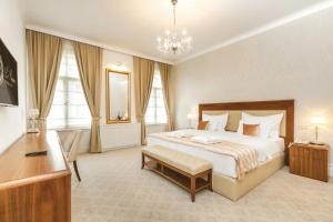 Postel nebo postele na pokoji v ubytování Hotel Le Premier