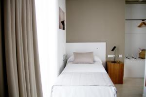 Postel nebo postele na pokoji v ubytování Sosiego Hostal de Mar