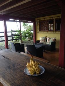 a bowl of bananas on a table in a room at Finca El Regalo in Capurganá