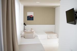 TV a/nebo společenská místnost v ubytování Sosiego Hostal de Mar