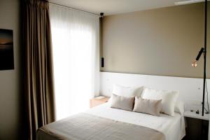 Postel nebo postele na pokoji v ubytování Sosiego Hostal de Mar