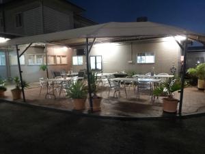 
a patio area with a patio table and chairs at Motel 707 in Emerald
