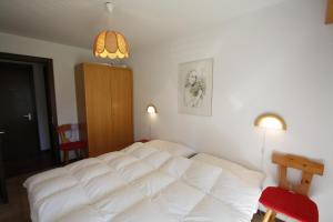 Postel nebo postele na pokoji v ubytování Residence Tsaumiau