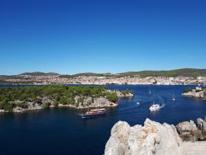 a group of boats in a body of water at Apartman Luna in Šibenik