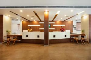 a lobby with two people sitting at a table at Sterling Thekkady in Thekkady