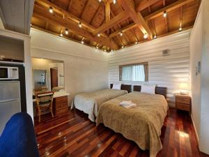 Säng eller sängar i ett rum på Nagahama Beach Resort Kanon