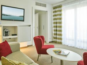 Televízia a/alebo spoločenská miestnosť v ubytovaní Werzers Hotel Resort Pörtschach