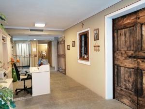 a hallway with a sliding barn door at Agriturismo Al Palaz in Prata Camportaccio