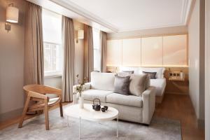 a living room with a couch and a bed at The Prince Akatoki London in London