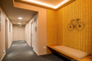 a bike hanging on a wall in a hallway at The People - Tours in Tours