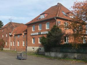 a large red brick building with a tiled roof at Hotel Adriatic in Hannover