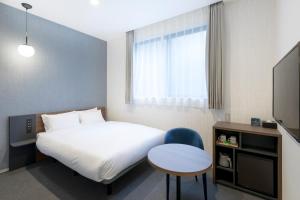 Postel nebo postele na pokoji v ubytování M's Hotel Sanjo Omiya