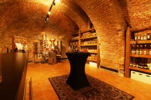a bar with a vase in the middle of a room at GOLDEN STAR - Premium Apartments in Melk