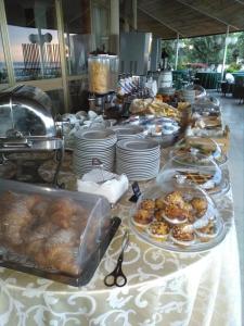a buffet line with plates of food on a table at Grand Hotel Fagiano Palace in Formia