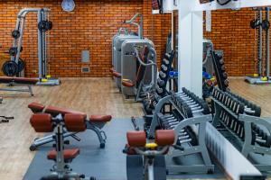a gym with rows of treadmills and machines at Willa Port in Mikołajki