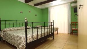 Posteľ alebo postele v izbe v ubytovaní B&B Ersilia