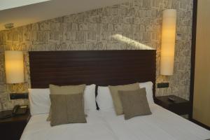 Ein Bett oder Betten in einem Zimmer der Unterkunft Hotel Gastronómico Casa Rosalia