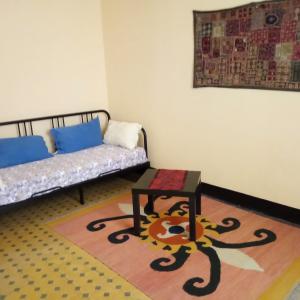 a living room with a couch and a table at Residenza dell'Orto in Chiavari