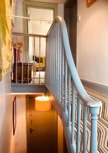 a stairway leading up to a room with a staircase at Hudsons in Brighton & Hove