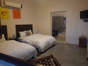 Letto o letti in una camera di Hotel Maculís