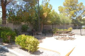 a park with tables and benches and a fence at Extended Stay America Suites - Las Vegas - Midtown in Las Vegas