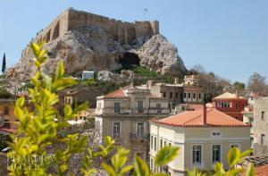 a large stone building with a mountain range at Phaedra Hotel in Athens