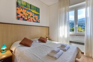 Postel nebo postele na pokoji v ubytování Hotel Roma