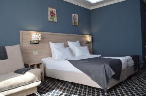 เตียงในห้องที่ Hotel Apriori
