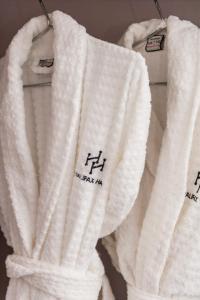 a white towel is hanging on a rack at Halifax Hall in Sheffield