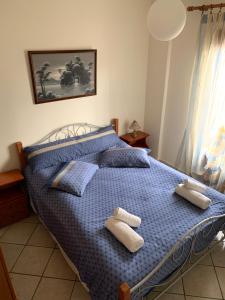 Posteľ alebo postele v izbe v ubytovaní Ifigenia Apartments