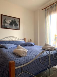 Posteľ alebo postele v izbe v ubytovaní Ifigenia Apartments