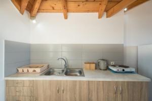 a kitchen with a sink and a counter top at Yiannis Studios in Tsilivi