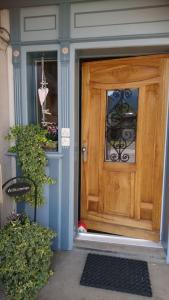 a wooden door on a house with at Zwinglis Ferienwohnung Klärli in Nesslau