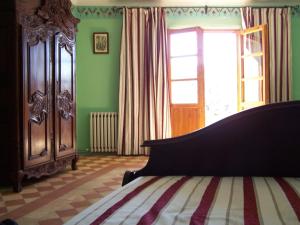 سرير أو أسرّة في غرفة في Casa Loriente