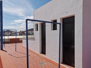 a building with two doors on the side of it at Apartamento Mendoza I - San Isidro in San Isidro