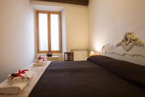 Posteľ alebo postele v izbe v ubytovaní Charming Fiesolana Apartment in heart of Florence