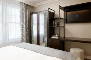 Ein Bett oder Betten in einem Zimmer der Unterkunft Hotel Atwater