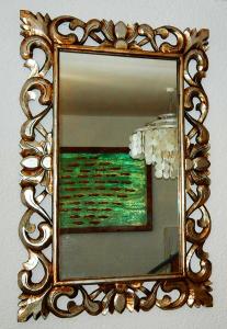 a mirror on a wall with a picture in it at Boutique Hotel Placa in Krk