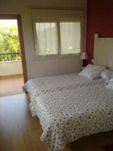 A bed or beds in a room at Casa Los Abetos