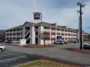 a large building with a sign on top of it at InTown Suites Extended Stay San Antonio TX - Leon Valley North in San Antonio