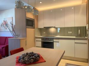 Kuchyň nebo kuchyňský kout v ubytování Apartment MIMI