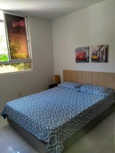 Cama o camas de una habitación en CH2 Comodo apartamento amoblado en condominio RNT 1O8237