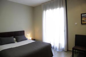 Llit o llits en una habitació de Hostal Portofino