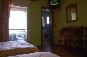 Postel nebo postele na pokoji v ubytování Hotel Los Duques