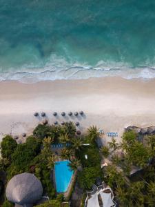 a beach scene with a large body of water at Diamonds Leisure Beach & Golf Resort in Diani Beach