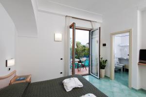 Postel nebo postele na pokoji v ubytování Hotel Floridiana Terme