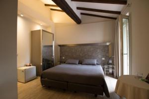 En eller flere senger på et rom på Residenza Solferino